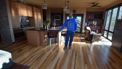 The Sandhages graciously invited John into their home to see their floor after installation.